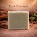 Bar of soap labeled 'Dark Patchouli' on a wooden surface with lavender and wood elements.