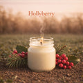Candle in a jar with holly leaves and berries on a natural background, featuring the brand 'Hollyberry'.