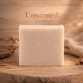 Unscented bar of soap on a wooden surface with a natural background